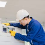 Industrial,Technician,Operating,Control,Panel,,Pushing,Button,,Wearing,Safety,Glasses,